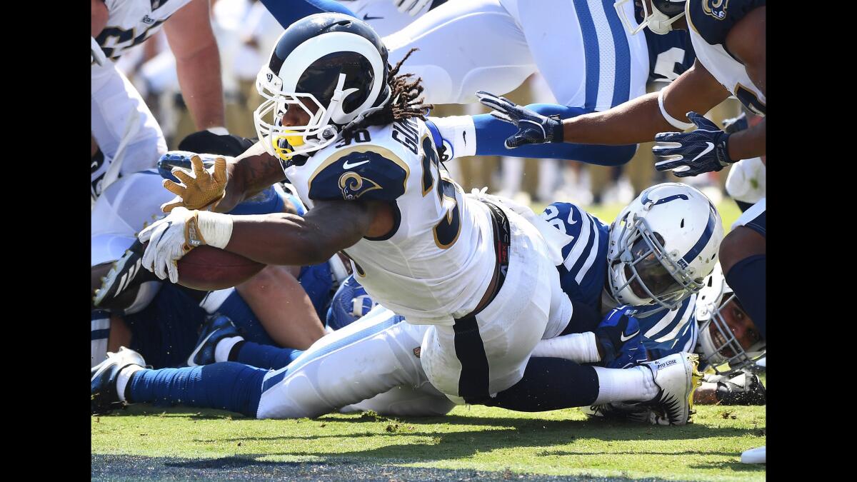 Rams running back Todd Gurley dives into the end zone for a touchdown during the second quarter.