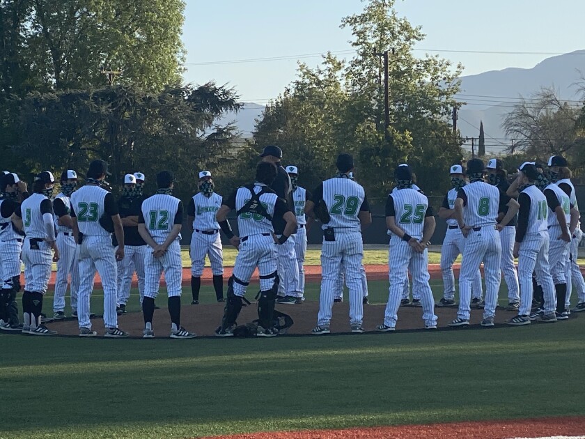 Thousand Oaks players receive a talk after hitting four home runs in 14-9 win over Westlake.