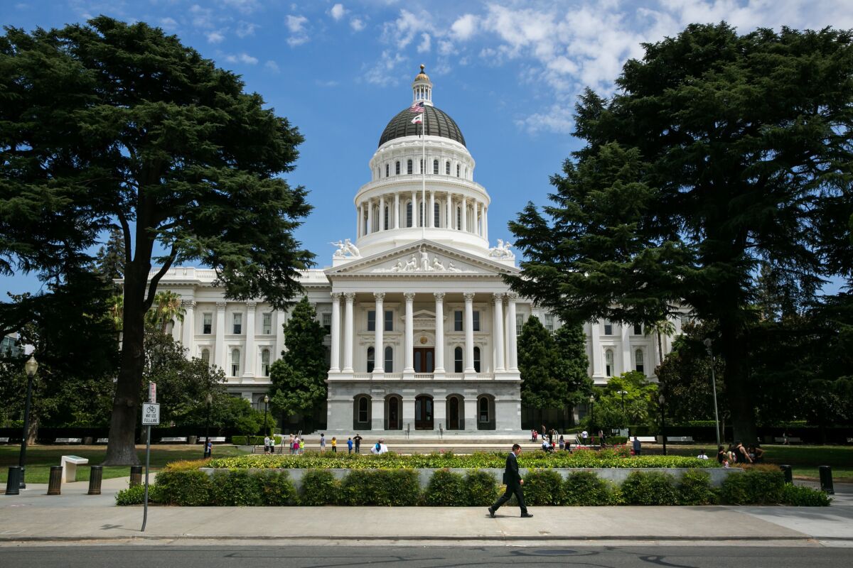 The exterior of the California State Capitol building under a blue sky