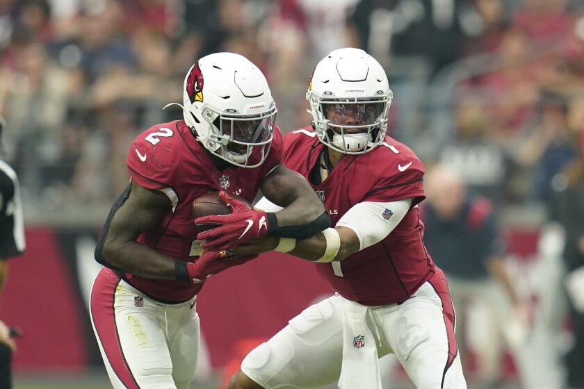 Arizona Cardinals running back Chase Edmonds (2) takes the handoff form the quarterback during a NFL football game against the Houston Texans, Sunday, Oct. 24, 2021, in Glendale, Ariz. (AP Photo/Matt Patterson)