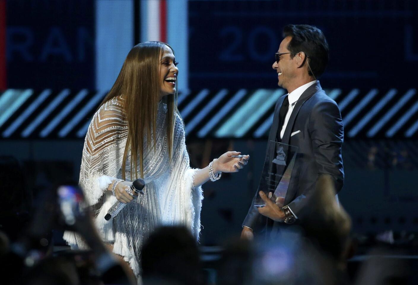 Lopez and Anthony react after she presented him with award honoring him as Latin Recording Academy person of the year at the 17th Annual Latin Grammy Awards in Las Vegas