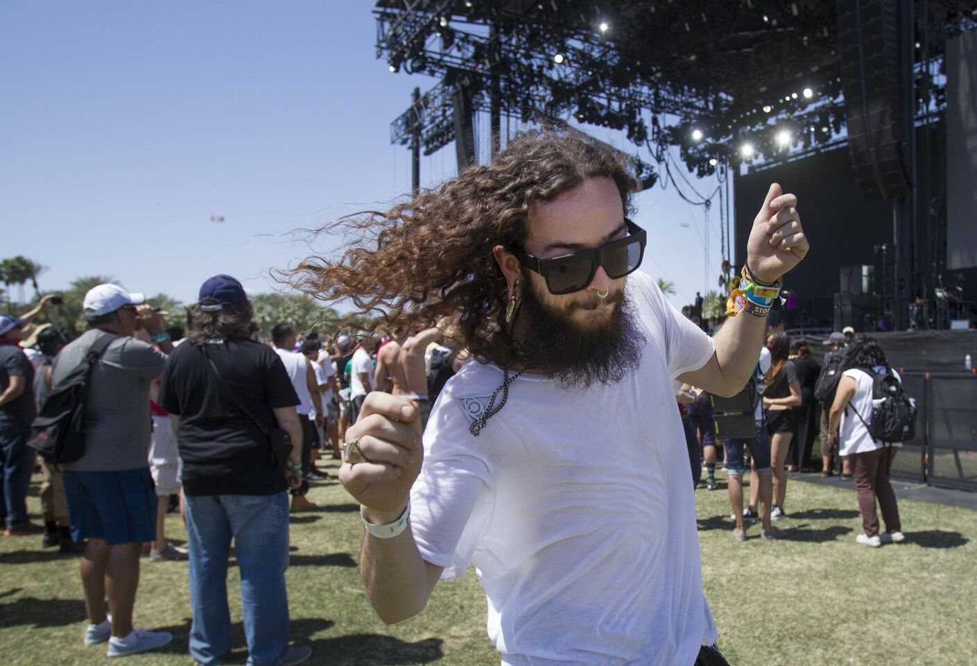 Day two of the 2015 Coachella Valley Music and Arts Festival . Brian Duenes of Los Angeles gets his groove on to the beat of the Tijuana, Mexico Band, The Nortec Collective.
