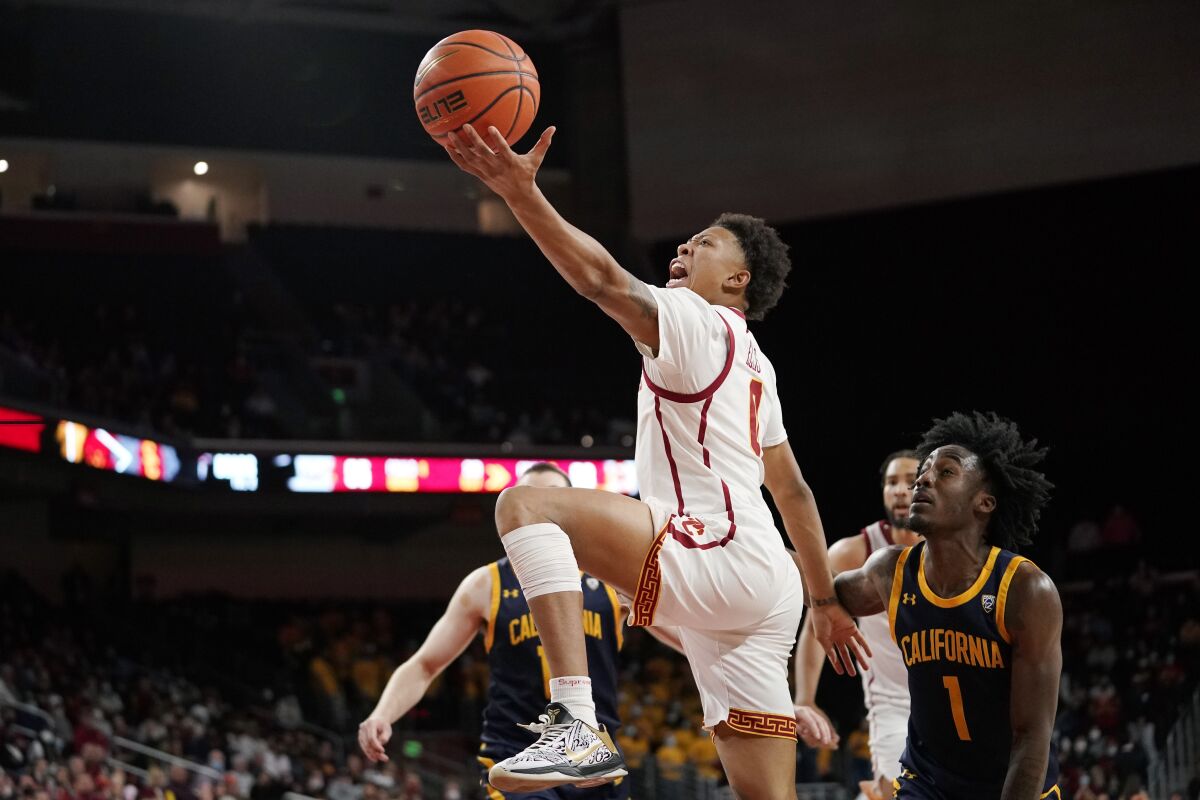 USC guard Boogie Ellis, who scored 21 points, gets past Cal's Joel Brown, right, to go up for a second-half shot.