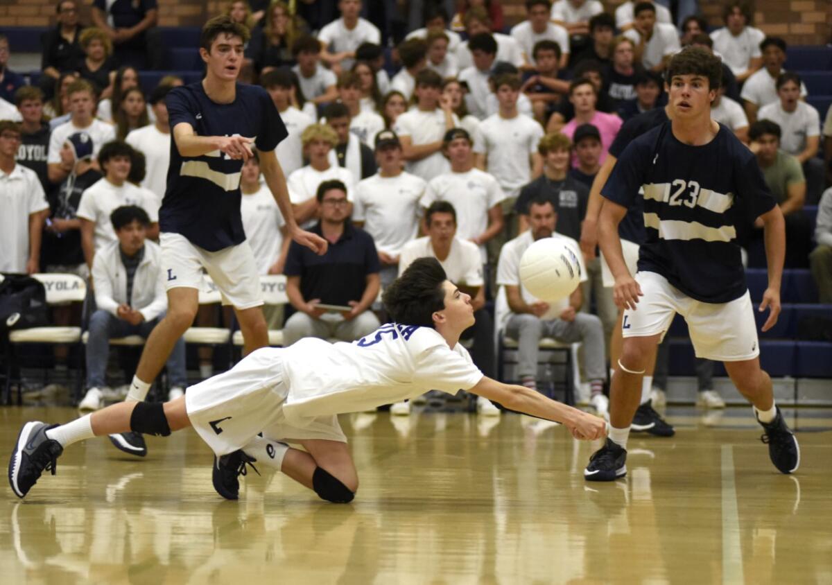 Loyola libero Grant Steuerwald makes a dig in the Division 1 semifinals against Beckman.