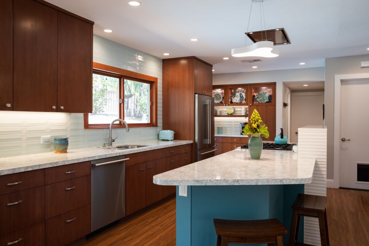 Custom cabinets by Hinze Building Interiors in the Zoni-McMakin home, fitted with Cambria Kendal quartz countertops.