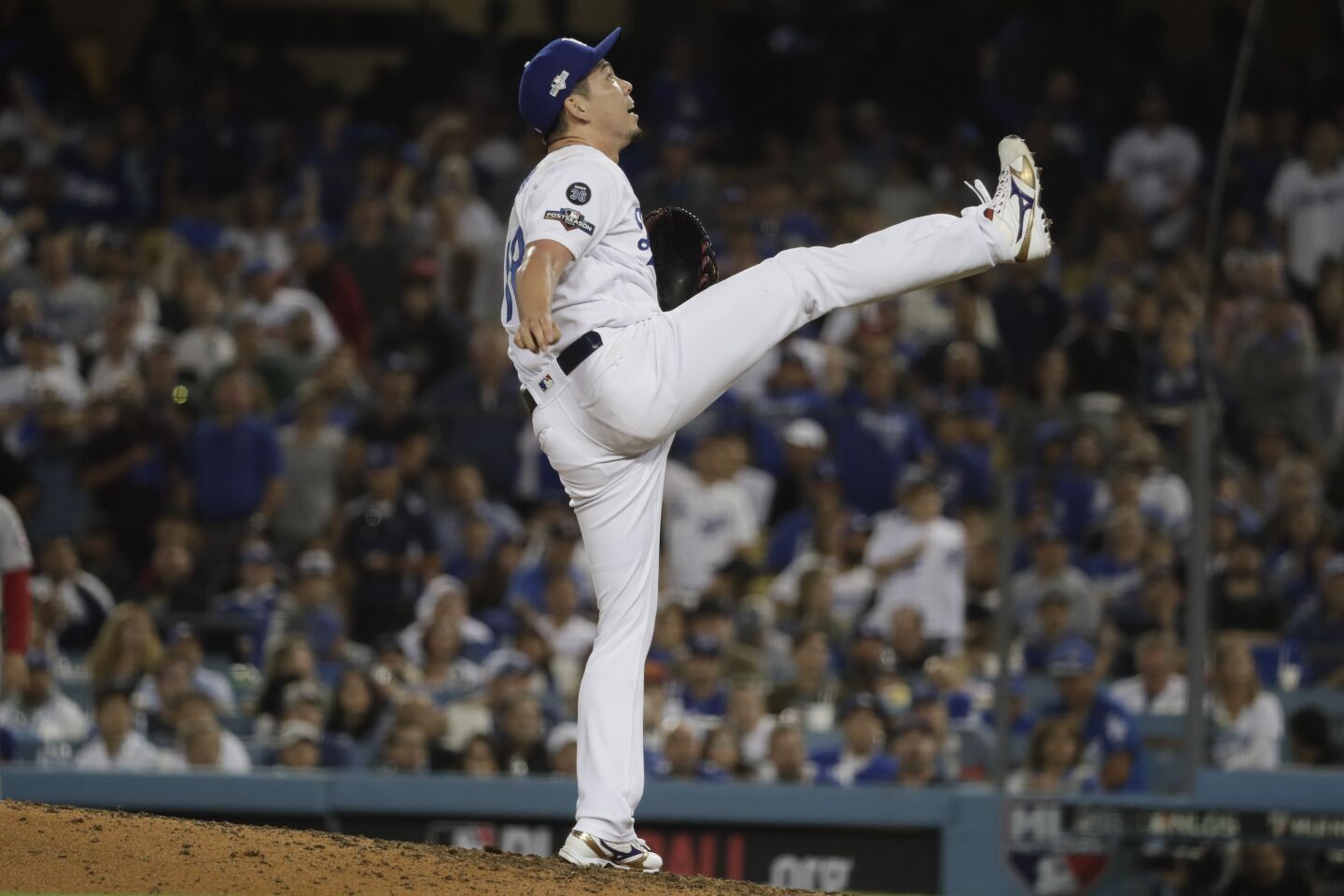 Dodgers reliever Kenta Maeda reacts to a popup during the seventh inning against the Washington Nationals.