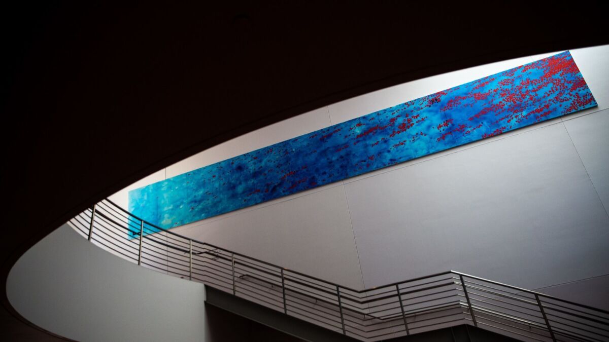 Peter Alexander's "Blue" hangs on a wall inside the Walt Disney Con
