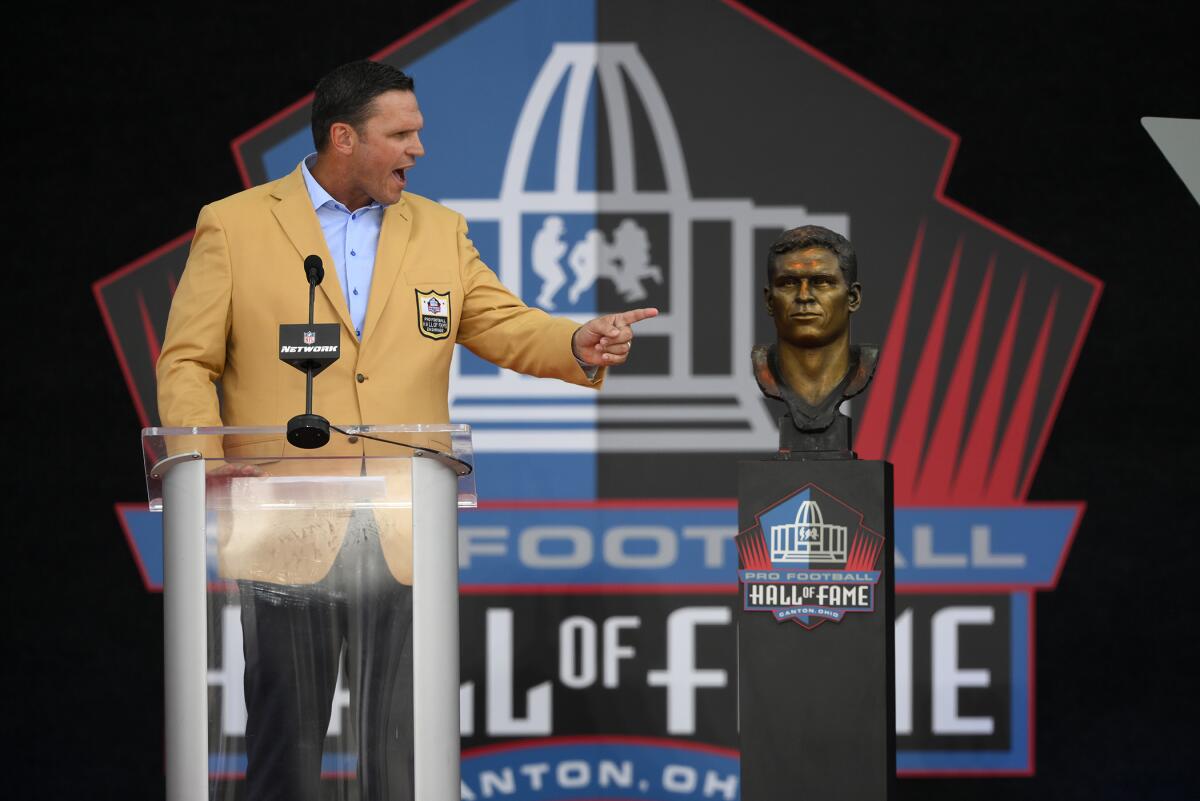 Former NFL player Tony Boselli speaks during his induction into the Pro Football Hall of Fame, Saturday, Aug. 6, 2022, in Canton, Ohio. (AP Photo/David Richard)