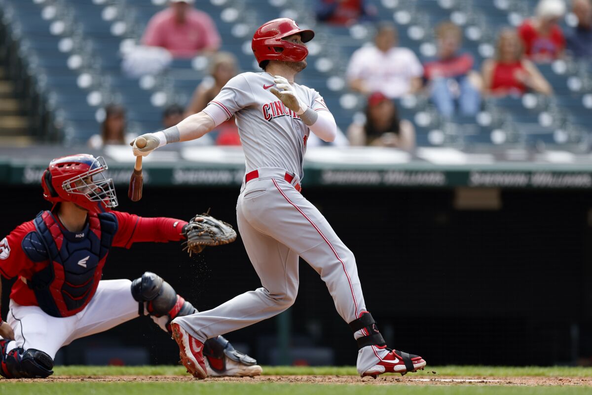 Cincinnati Reds' Tyler Naquin hits a single against the Cleveland Guardians during the eighth inning of a baseball game, Thursday, May 19, 2022, in Cleveland. (AP Photo/Ron Schwane)