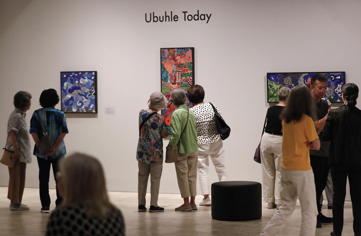 Guests admire the work of the Ubuhle women at the Bower's Museum.