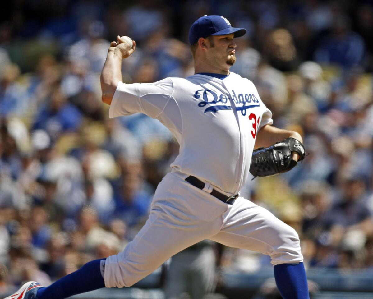 Dodgers pitcher Brad Penny delivers a pitch in the first inning during the Dodgers season home opener against the Giants in 2008.