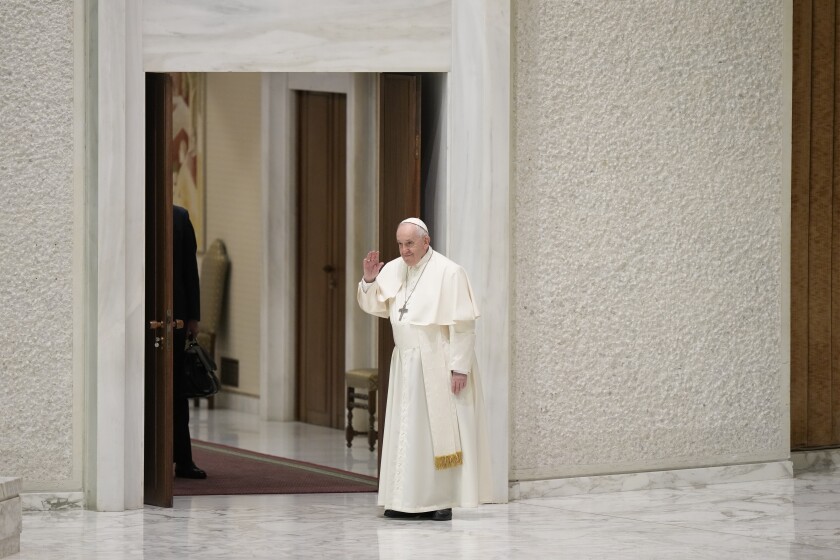 Pope Francis arrives to attend his weekly general audience in the Paul VI Hall at The Vatican, Wednesday, April 13, 2022. (AP Photo/Andrew Medichini)