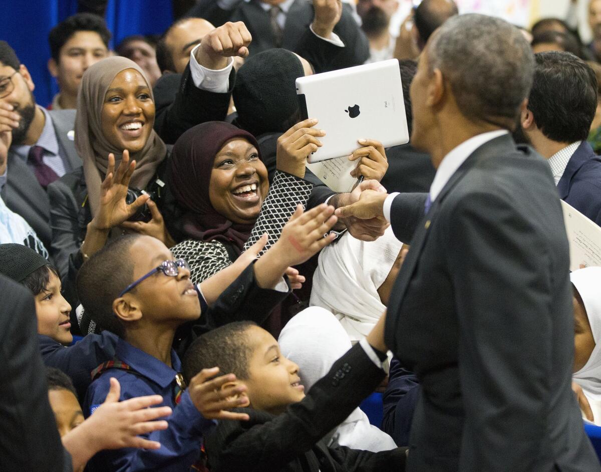 President Obama greets children and other guests during his visit to the Islamic Society of Baltimore on Feb. 3, 2016.