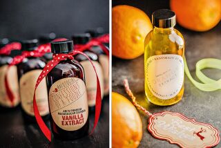 Bottles of vanilla and orange extracts for baking ready for gift-giving.