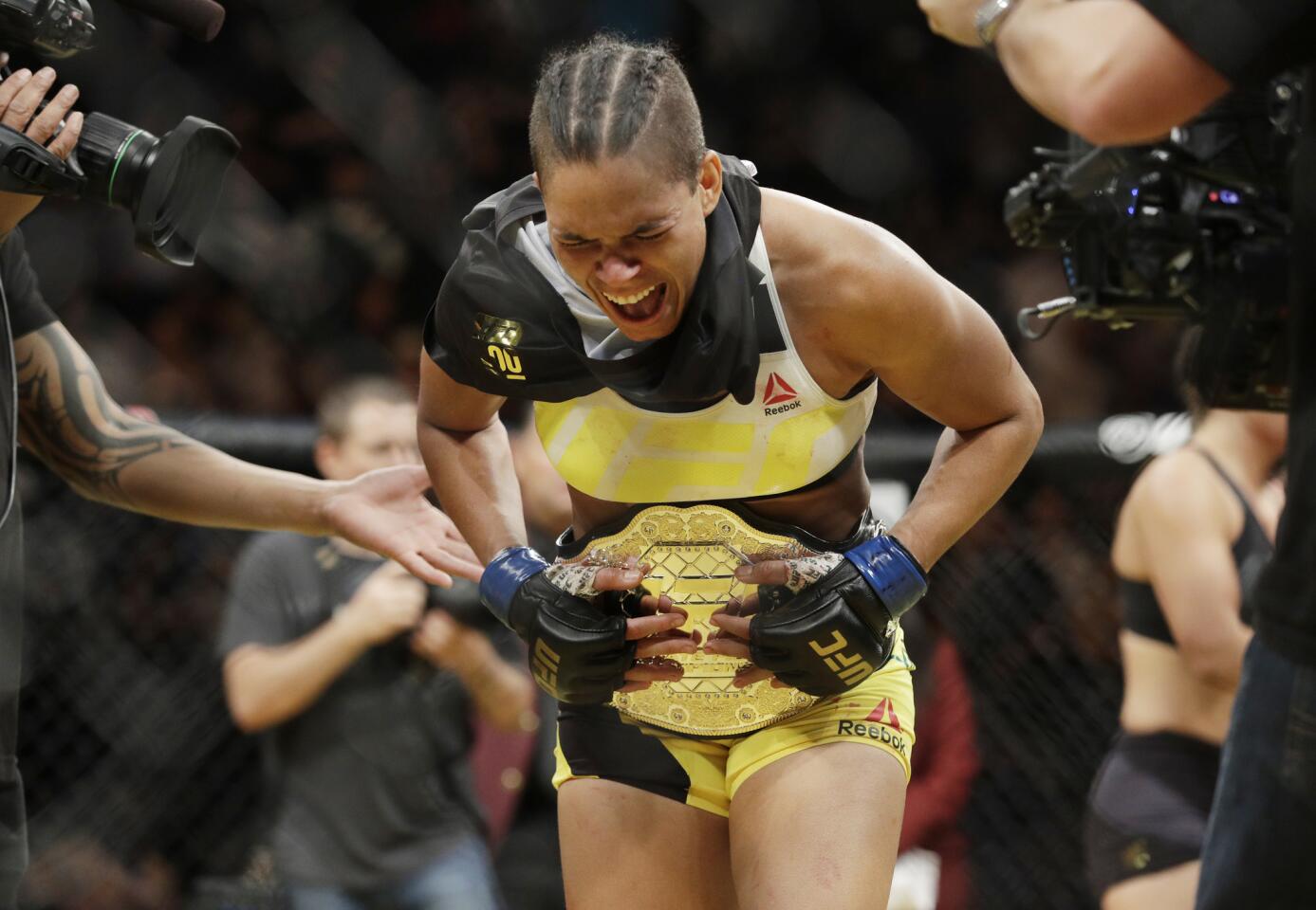 Amanda Nunes celebrates after defeating Miesha Tate to claim the women's bantamweight title at UFC 200 in Las Vegas on July 9.