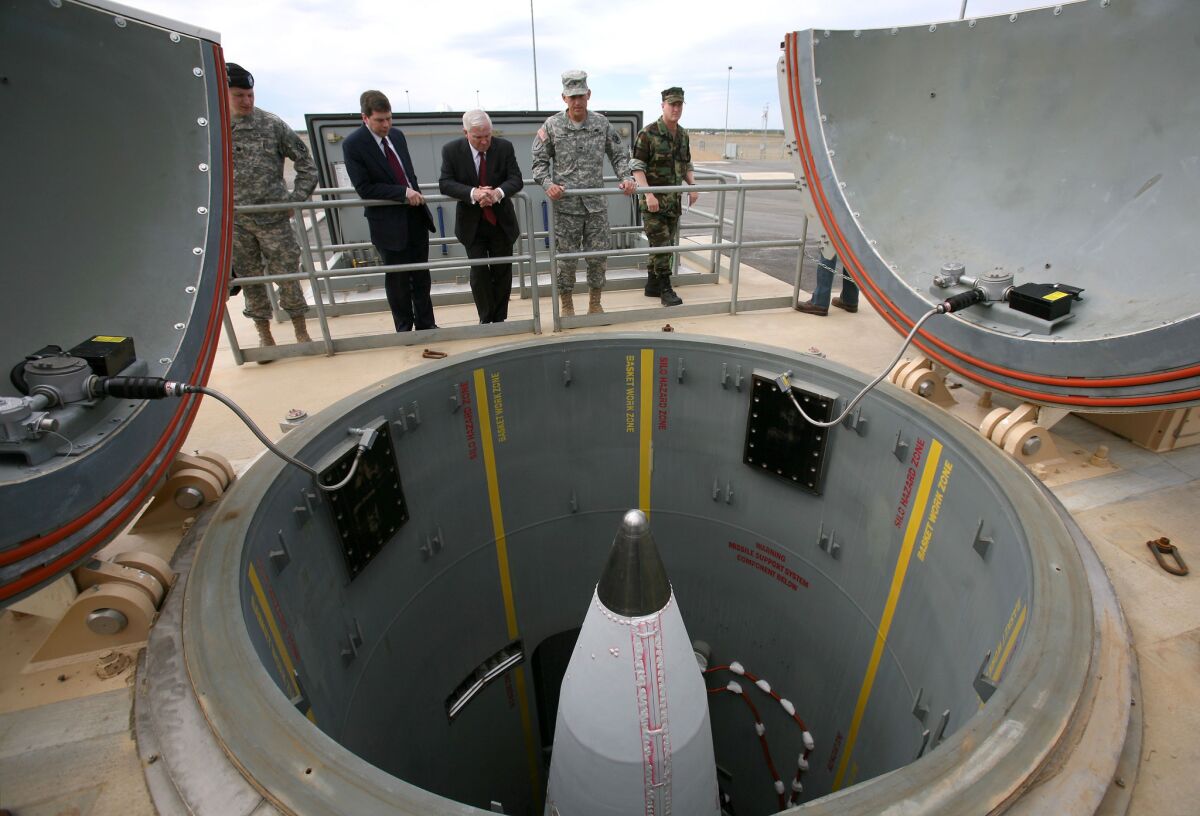 In this June 1, 2009, photo, Defense Secretary Robert Gates, center, gets briefed on interceptor missiles at Ft. Greely, Alaska. The missiles carry a nonexplosive "kill vehicle" that is supposed to intercept and destroy enemy ballistic missiles in space.