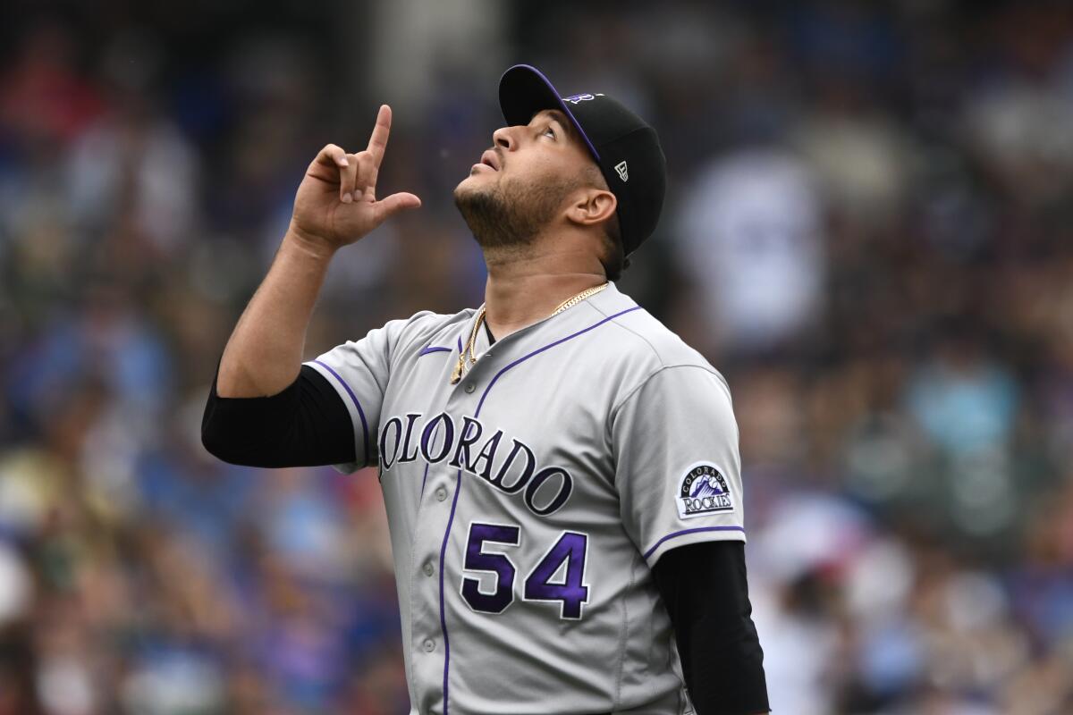 Colorado Rockies relief pitcher Carlos Estévez gestures during a game against the Chicago Cubs in September.