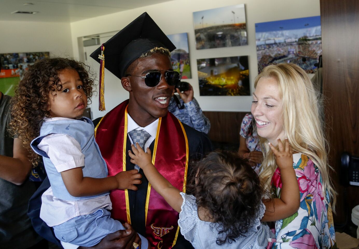 Galaxy soccer star Gyasi Zardes celebrates with his wife, Madie, and children, Gyan and Maylie, after graduating from Cal State Dominguez Hills.