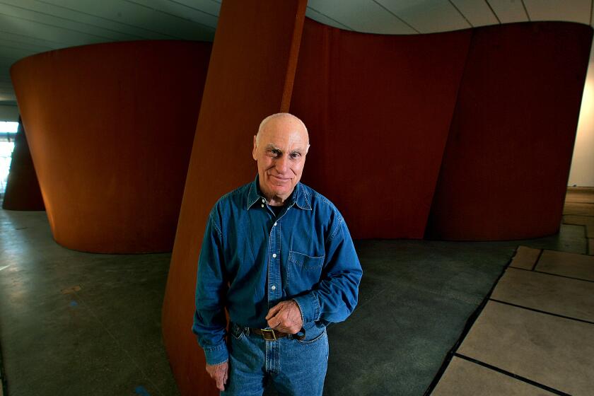 Richard Serra in front of his sculpture installation at LACMA.