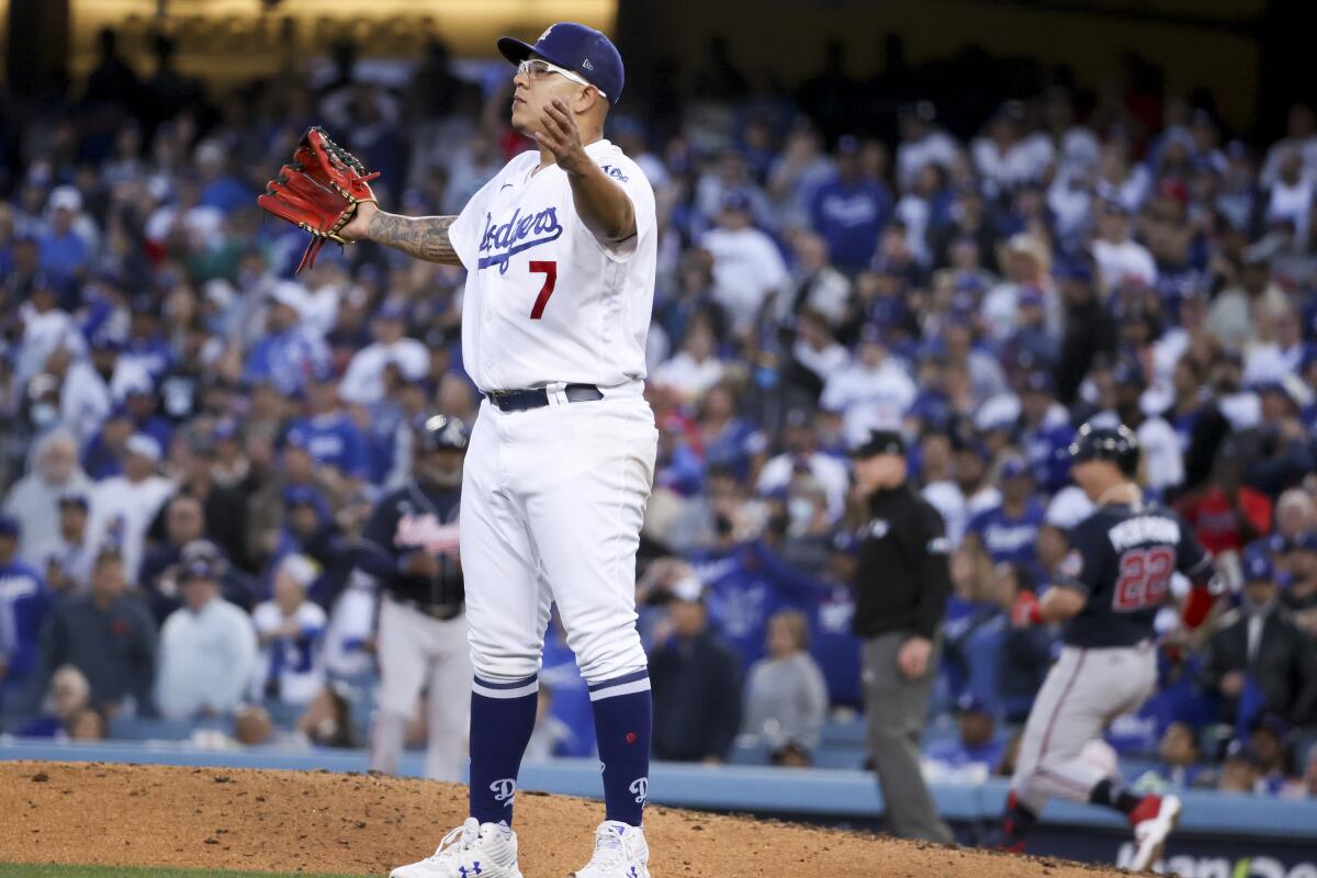 Dodgers pitcher Julio Urías reacts after center fielder Gavin Lux couldn't make a catch.