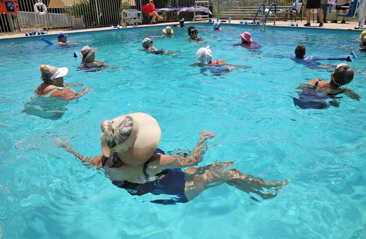 Mermaids enjoy a special Deep Water Aquafit class.