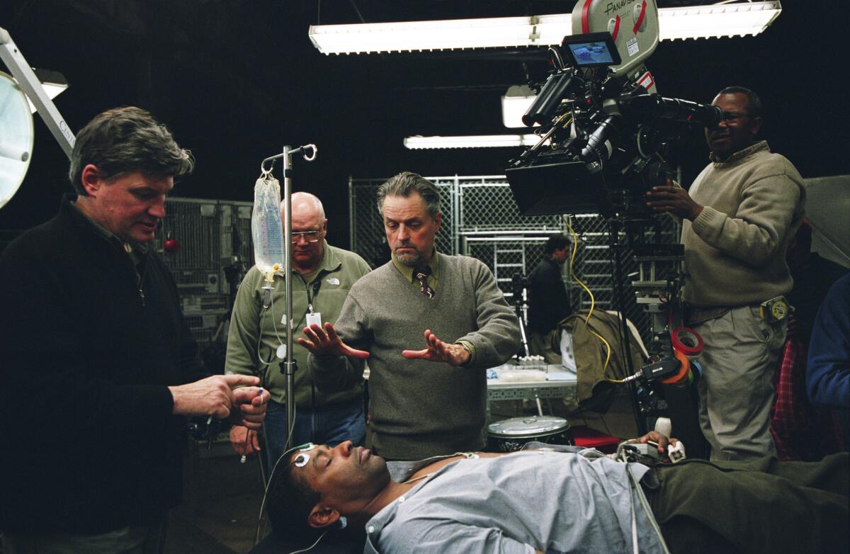 Director Jonathan Demme, center, frames a shot of Denzel Washington on the set of 2004's "The Manchurian Candidate" (Ken Regan / Paramount Pictures)