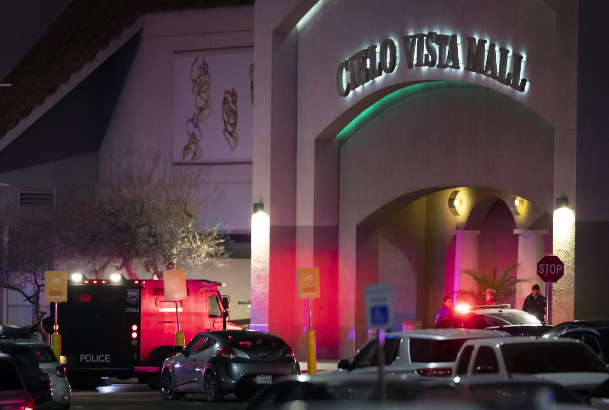 Law enforcement agents are seen at an entrance of the Cielo Vista Mall in El Paso, Texas.