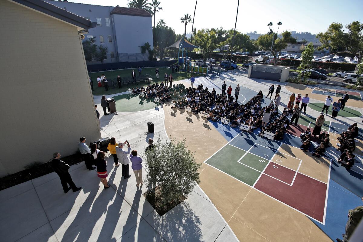 Holy Family Grade School held a ribbon-cutting ceremony on campus on Tuesday. The school received a donation from the Shea Family Charities and upgraded its fencing, hardscape, landscape, play and exercise areas. The improvements were made mostly during the summer. Benefactors were John and Dorothy Shea.