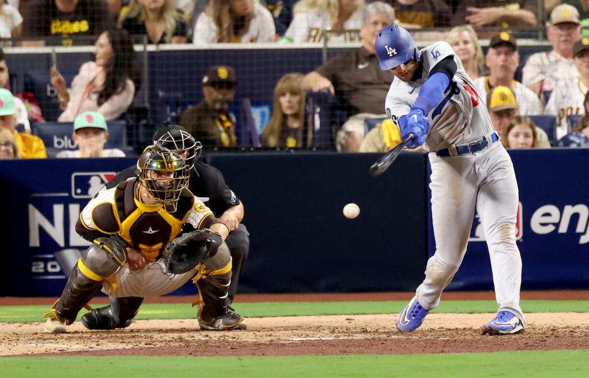 Dodgers outfielder Trayce Thompson strikes out during the seventh inning.
