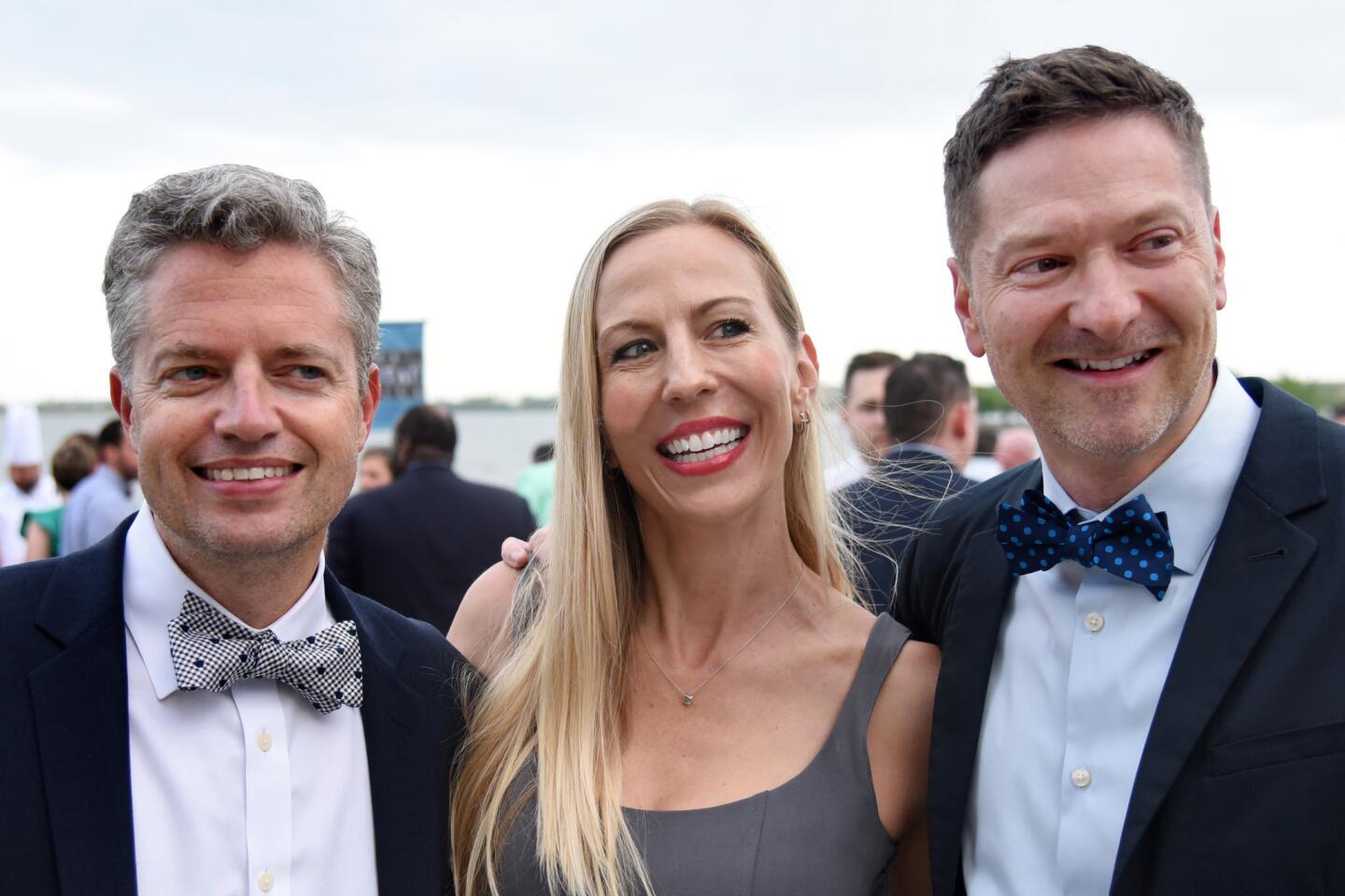 From left, David Jacobs with Erin and Stephen Ross at the Bourbon and Bowties charity fundraiser held at Rye Street Tavern in Port Covington.