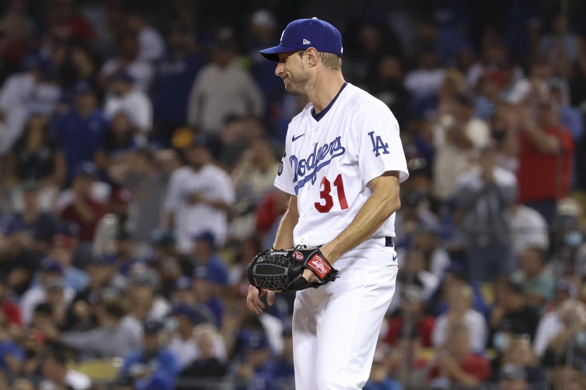 Los Angeles Dodgers starting pitcher Max Scherzer reacts on the mound during the fifth inning