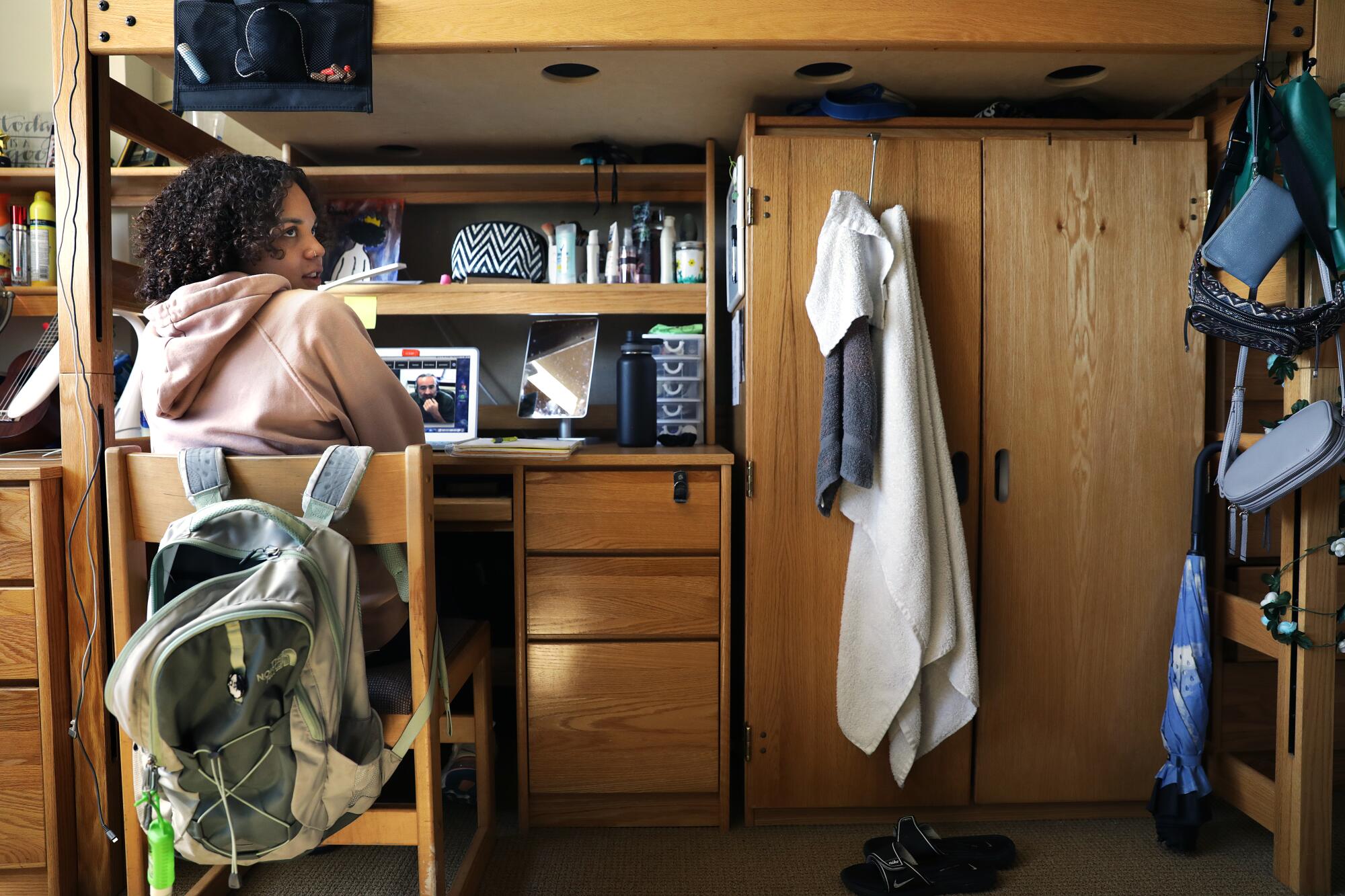 UCLA student Kiera Laney, 20, attends a class online in her dorm room on campus.
