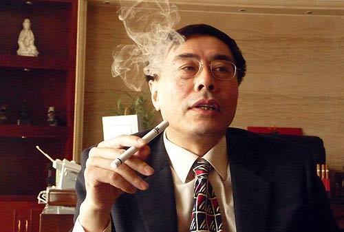 Former smoker Hon Lik of Beijing demonstrates the electronic cigarette he invented. The device doesnt burn, but instead uses a small lithium battery to atomize a liquid solution of nicotine. The "smoke" inhaled is a vapor similar to the stage fog used in theatrical productions.