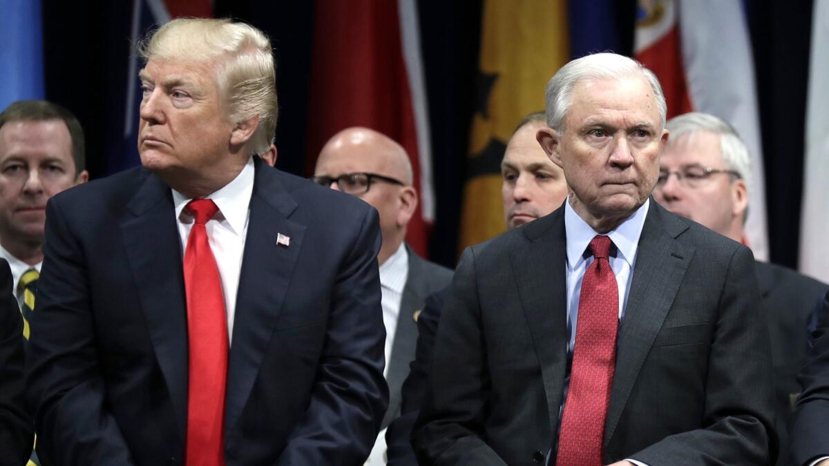 President Donald Trump and Attorney General Jeff Sessions attend the FBI National Academy graduation ceremony in Quantico, Va. on Dec. 15, 2017.