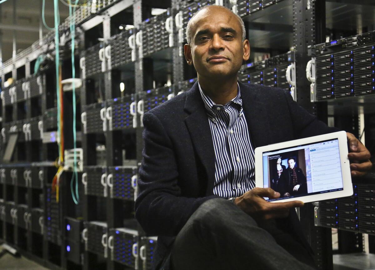 In New York, Chet Kanojia, founder and chief executive of Aereo, shows a tablet displaying his company's technology.