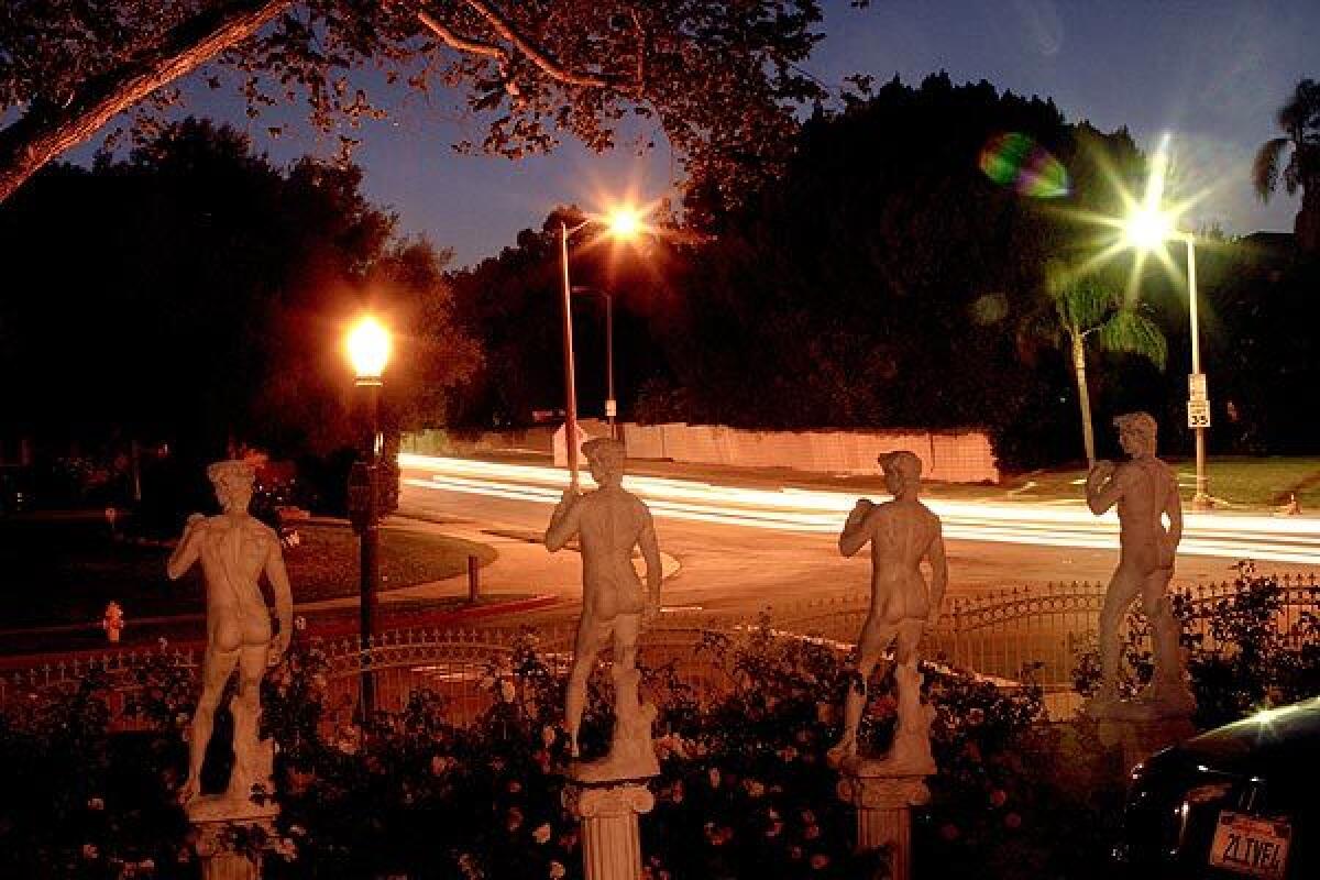 Miniature statues of David line the frontyard of a Hancock Park residence