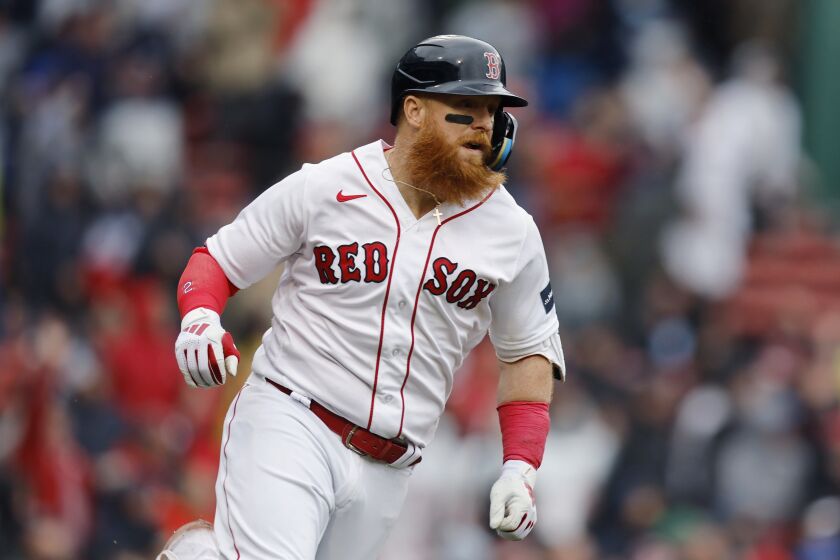 Boston Red Sox's Justin Turner runs on his three-run double during the sixth inning of the first baseball game of a doubleheader against the Tampa Bay Rays, Saturday, June 3, 2023, in Boston. (AP Photo/Michael Dwyer)