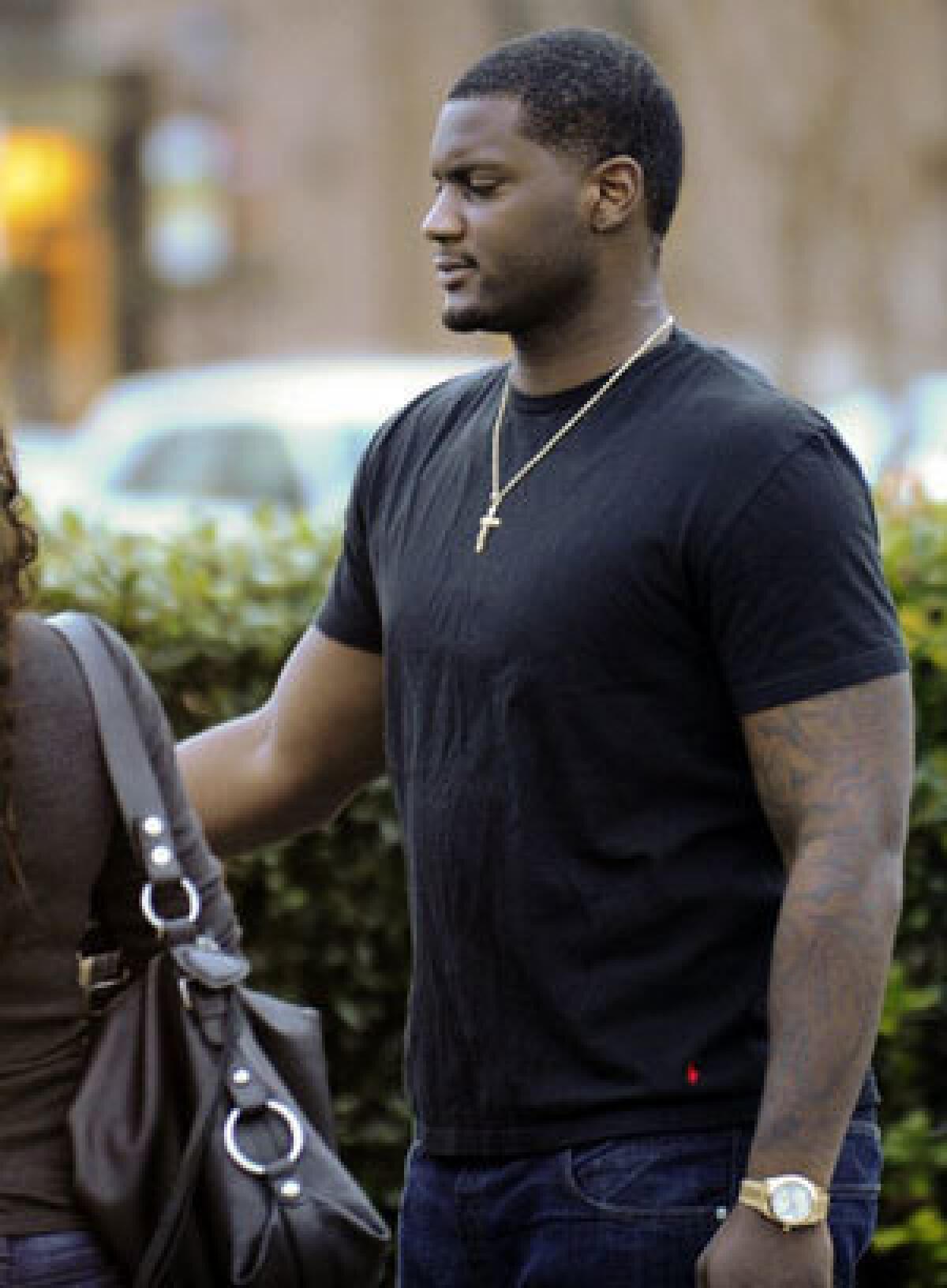 Rolando McClain leaves the Decatur, Ala., police station after posting bail Tuesday.