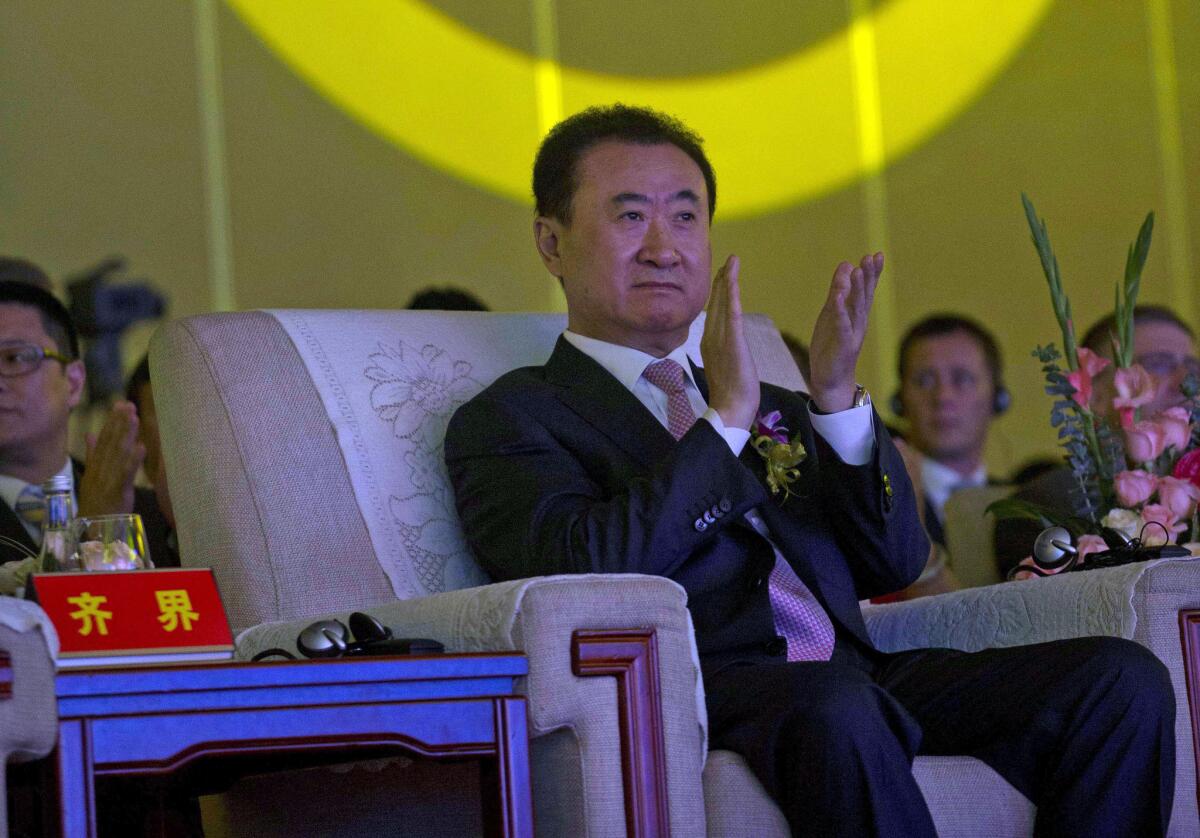 Wanda Chairman Wang Jianlin appears at an event in Beijing last year. The billionaire told Bloomberg News on Dec. 1 that Dalian Wanda Group is interested in buying control of Lionsgate and investing in Metro-Goldwyn-Mayer Inc.