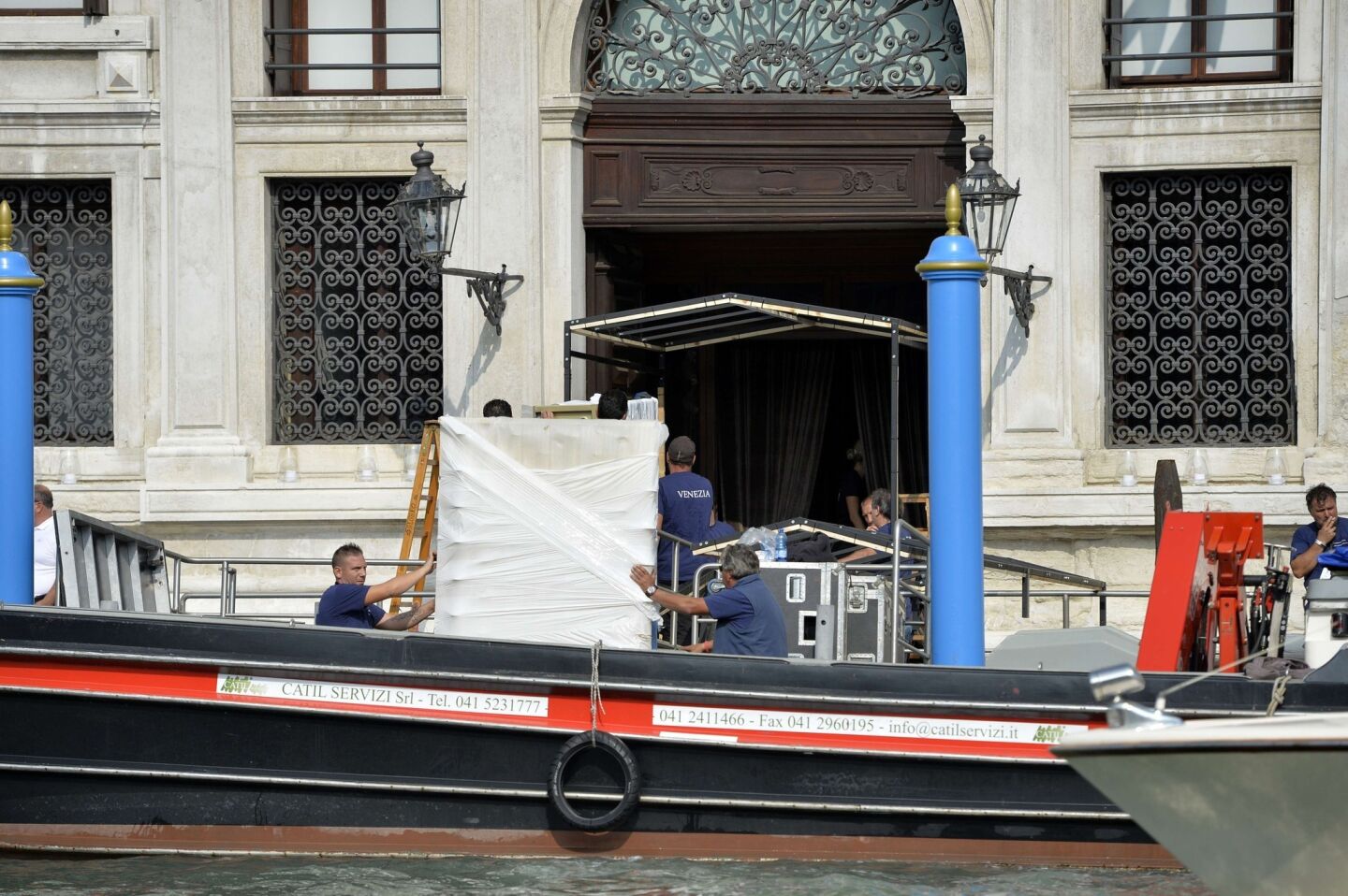 Workers prep for the Clooney-Alamuddin wedding and reception at the Aman Canal Grande hotel in Venice.