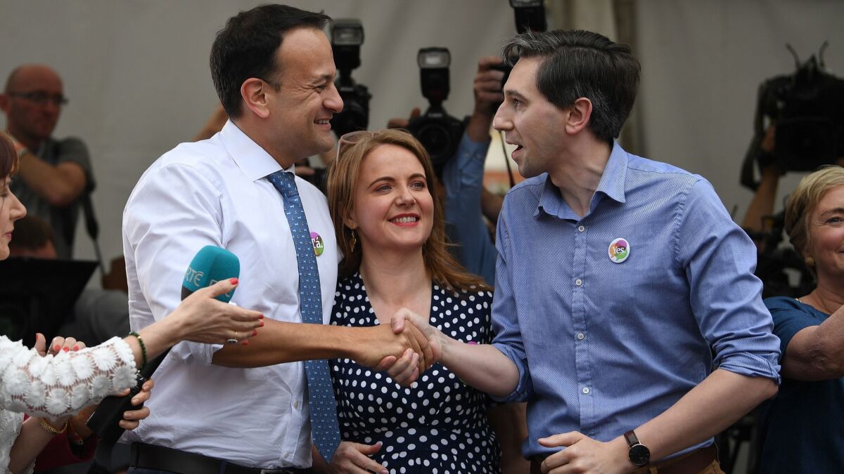 Prime Minister Leo Varadkar, left, greets voters at a watch party for supporters of a referendum to repeal Ireland’s abortion laws at Dublin Castle on May 26, 2018.