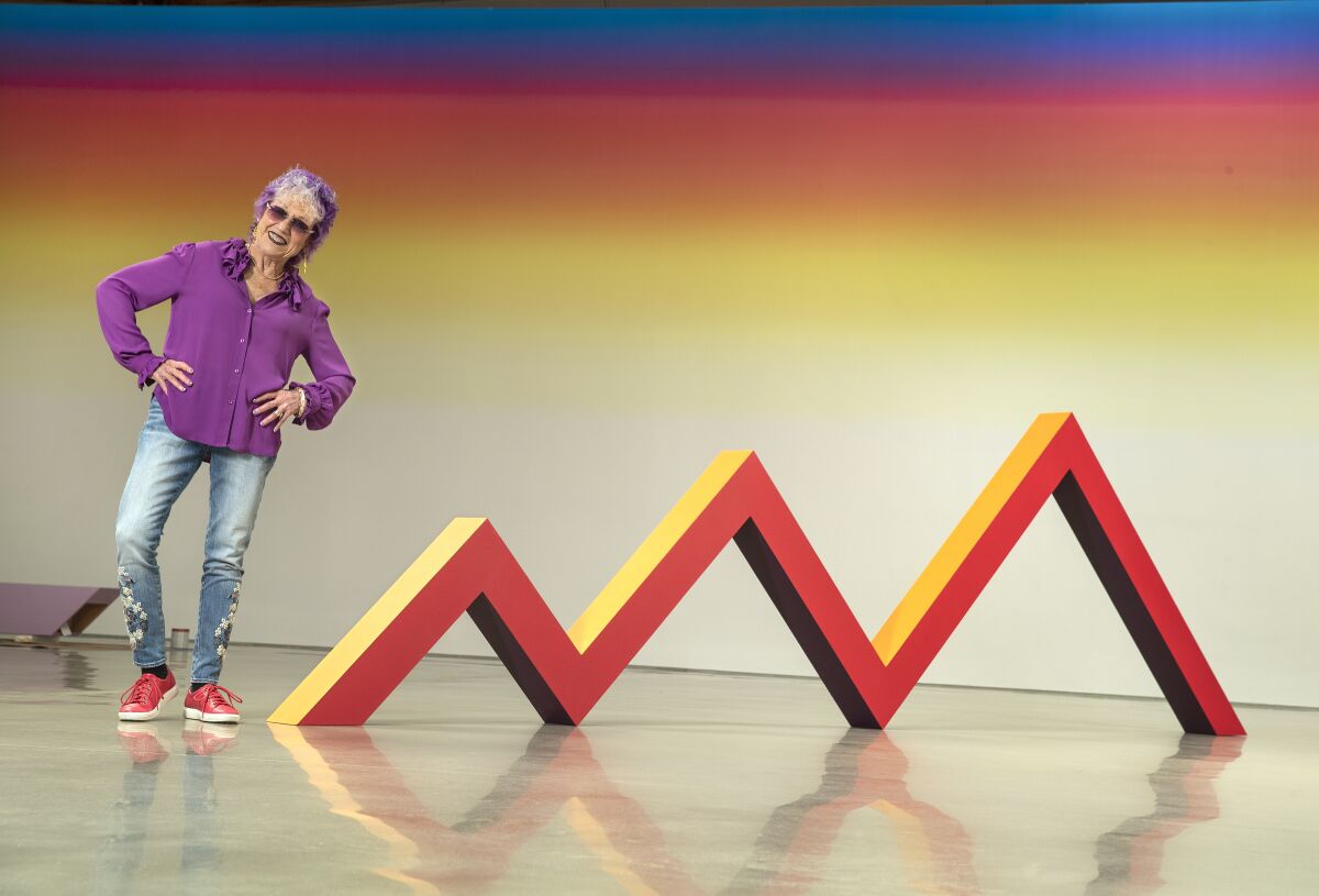 Artist Judy Chicago next to her piece "Zig Zag," acrylic on canvas-covered plywood, from 1965, remade in 2019, on display at Deitch gallery in Hollywood.