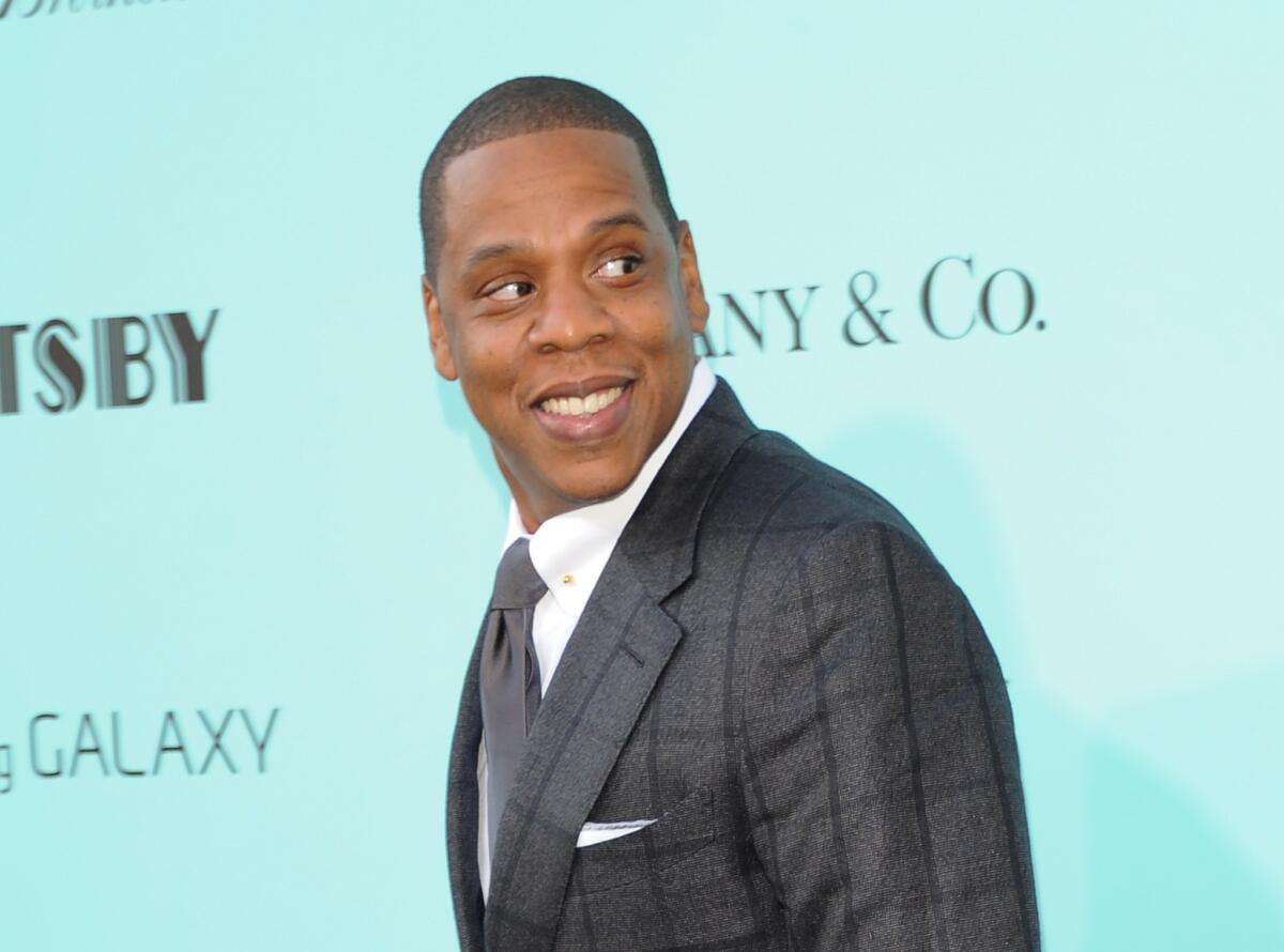 Rapper Jay-Z has said he was the victim of a "massive years-long fraud" perpetrated by Iconix Brands, which had accused him of trademark infringement. The company's former CEO, Neil Cole, has now been charged with accounting fraud.