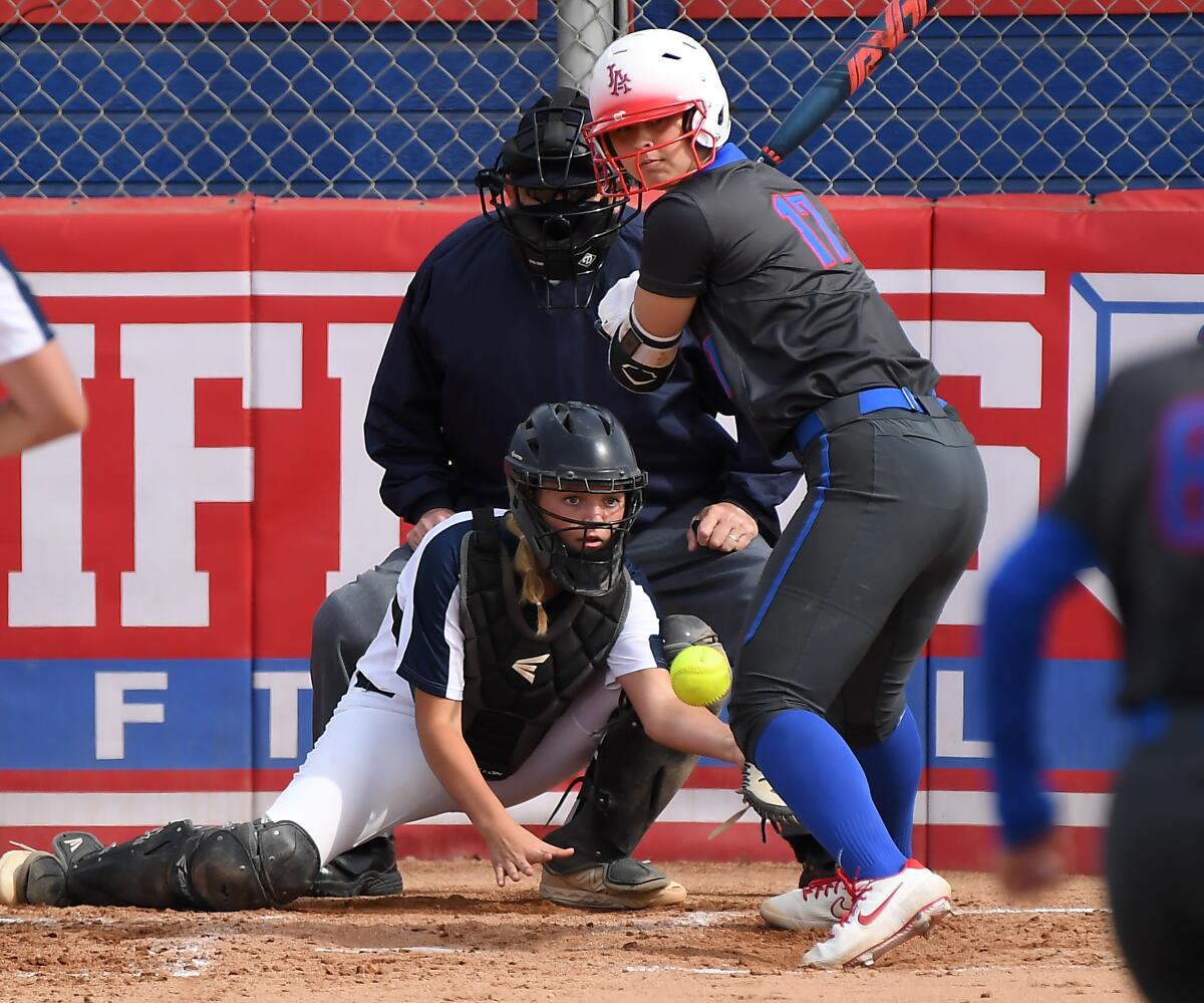 Los Alamitos' Sophia Nugent gets hit by a pitch during a recent game.