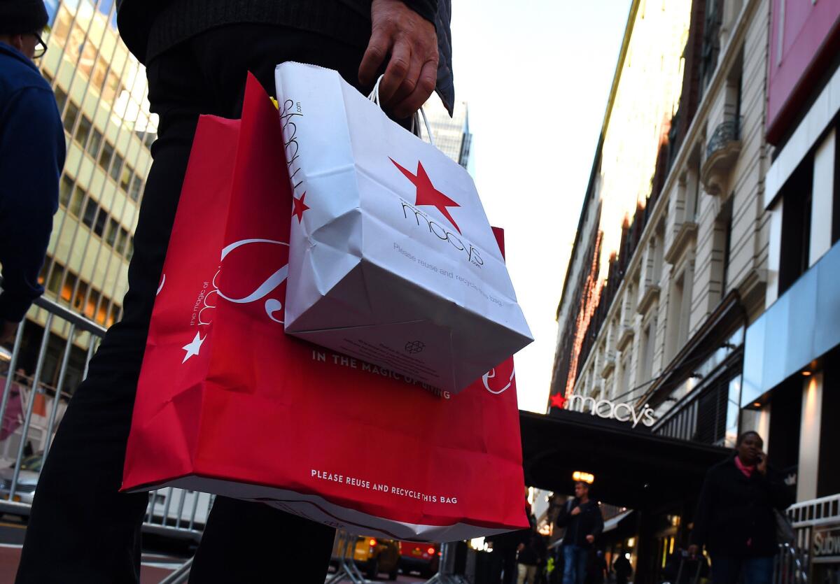 Shoppers are seen outside Macy's Herald Square in midtown Manhattan on Nov. 20.