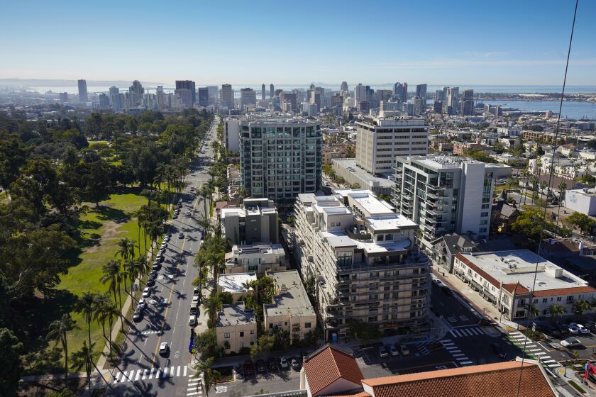 SAN DIEGO, CA - FEBRUARY 9: The view looking toward downtown San Diego, along with Balboa Park on the left and San Diego Bay on the right, from the 20th floor sky lounge of 525 Olive, Greystar's new $100.2 million apartment tower in Bankers Hill Wednesday Feb. 9, 2022. It is set to open in April. (Howard Lipin / For The San Diego Union-Tribune)
