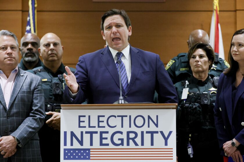 FILE - Florida Gov. Ron DeSantis speaks during a news conference at the Broward County Courthouse in Fort Lauderdale, Fla., Aug. 18, 2022. Florida, Georgia, Texas and Virginia all started new law enforcement units to investigate voter fraud in this year’s elections based on former President Donald Trump’s lies about the 2020 presidential contest. So far, those units seem to have produced more headlines than actual cases. (Amy Beth Bennett/South Florida Sun-Sentinel via AP, File)