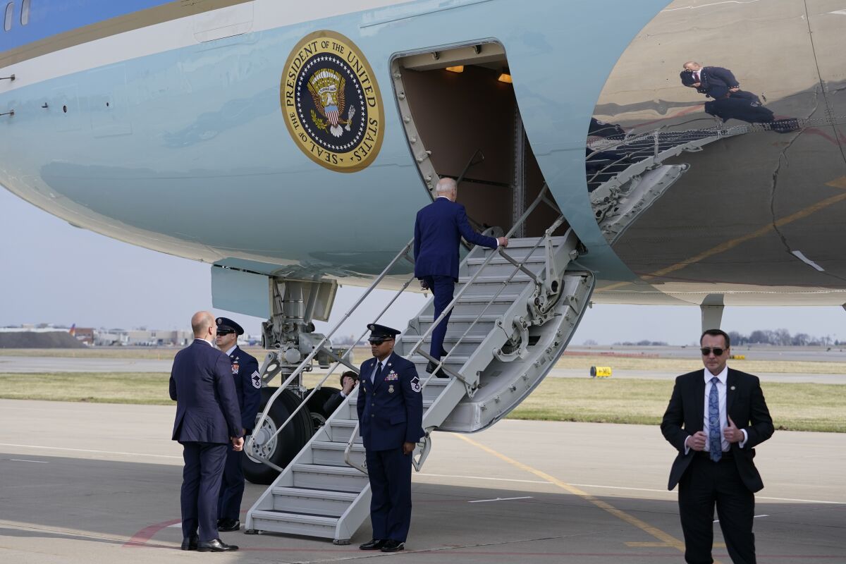 President Joe Biden boards Air Force One at Des Moines International Airport, in Des Moines Iowa, Tuesday, April 12, 2022, en route to Washington. (AP Photo/Carolyn Kaster)