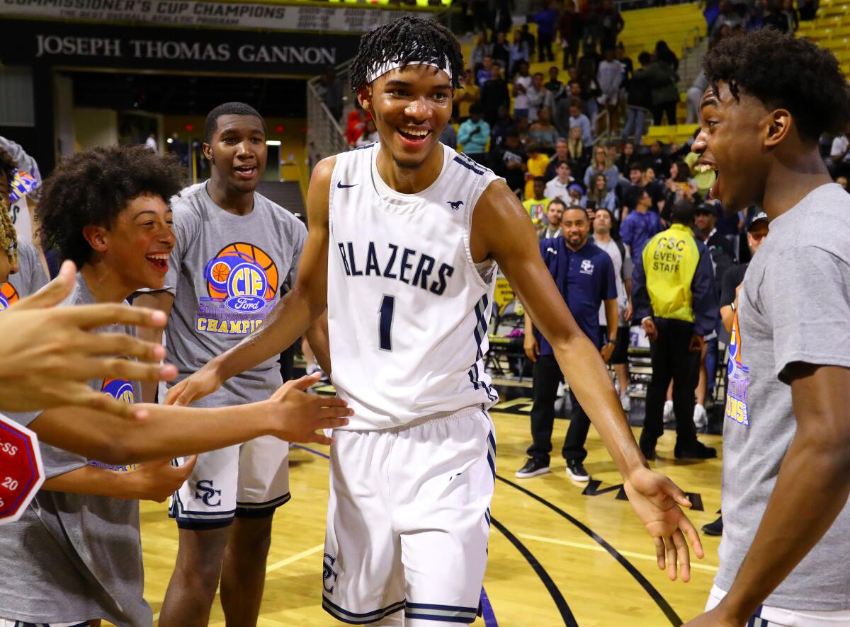 Sierra Canyon's Ziaire Williams (1) celebrates with teammates after the Trailblazers won the Southern Section Open Division championship on Feb. 28, 2020, in Long Beach.