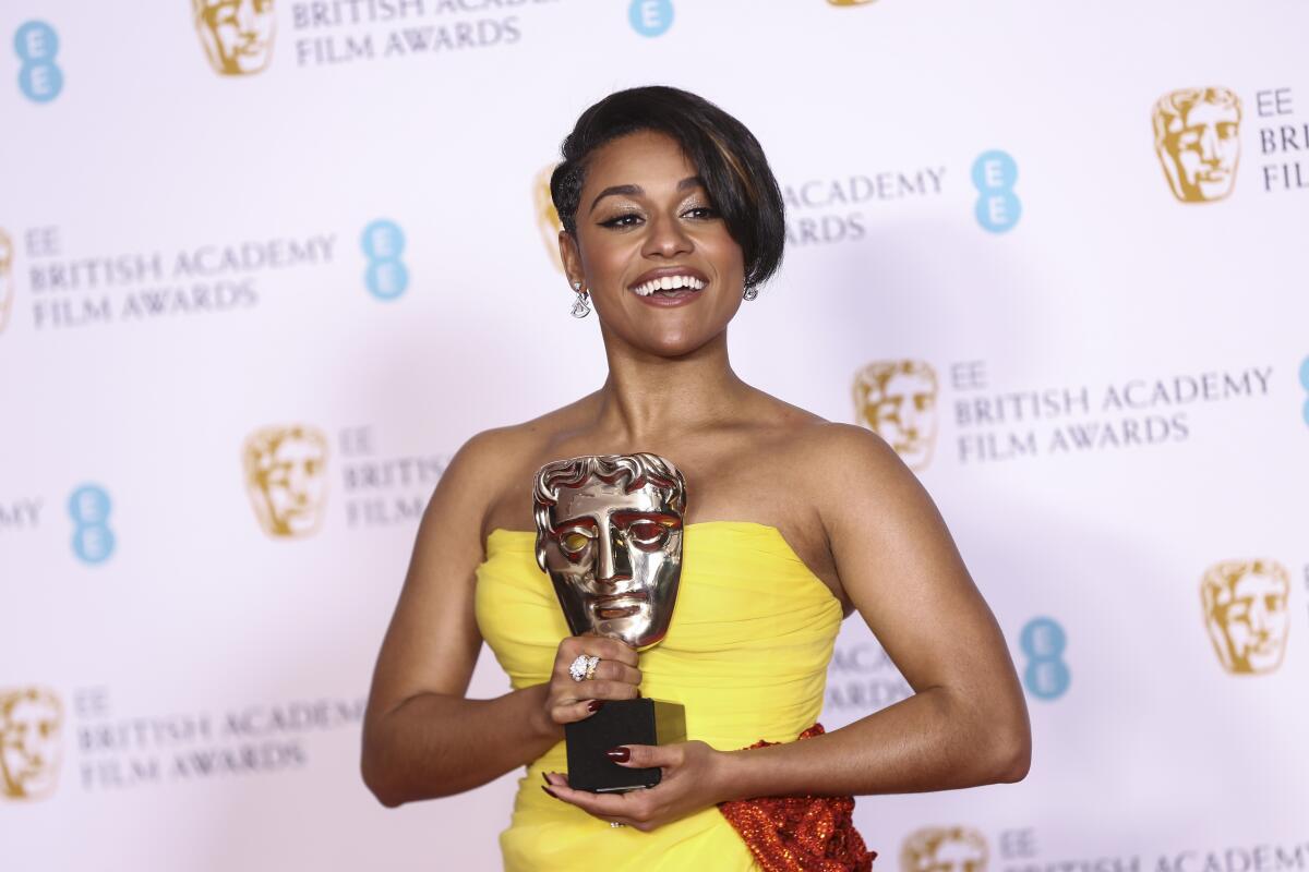 Ariana Debose holds her Supporting Actress award for her role in the film 'West Side Story'